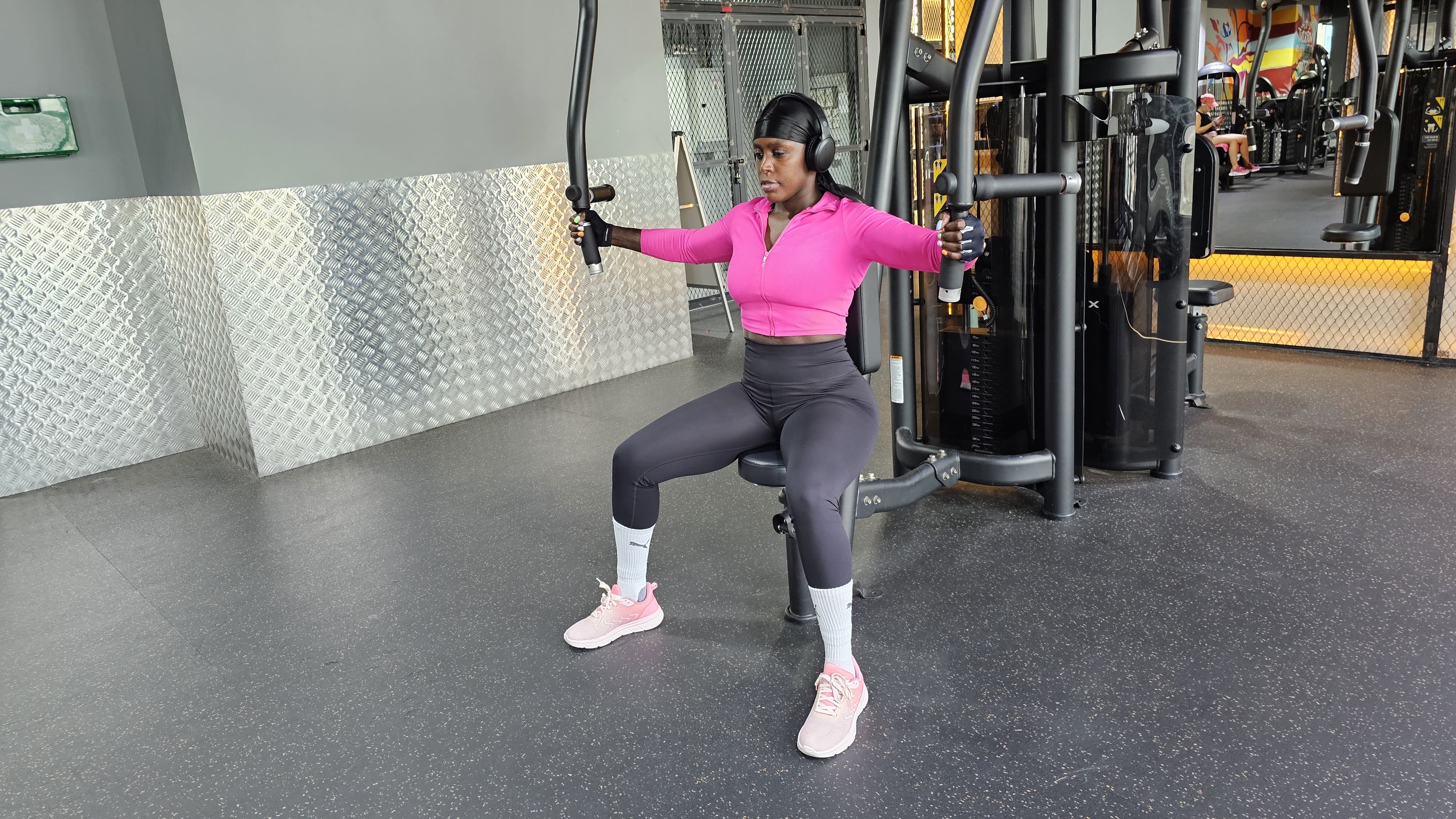 Jojo working out on cable machine